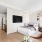 studio apartment with bed and tv